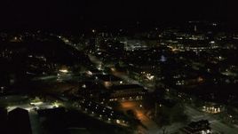 5.7K aerial stock footage fly away from the downtown area near Battery Street at night and descend, Burlington, Vermont Aerial Stock Footage | DX0002_226_064