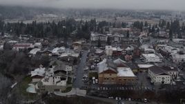 5.7K aerial stock footage rooftops dusted with snow in the small town, Leavenworth, Washington Aerial Stock Footage | DX0002_227_009