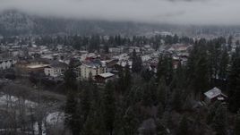5.7K aerial stock footage ascend from trees for view of the town, Leavenworth, Washington Aerial Stock Footage | DX0002_227_011