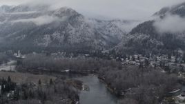 5.7K aerial stock footage follow the river toward Leavenworth, Washington and snowy mountains Aerial Stock Footage | DX0002_227_016