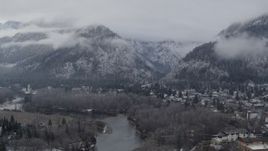 5.7K aerial stock footage of flying by Leavenworth and snowy mountains, Washington Aerial Stock Footage | DX0002_227_020
