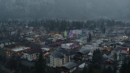 5.7K aerial stock footage stationary view of tall Christmas trees at the center of town, Leavenworth, Washington Aerial Stock Footage | DX0002_227_034