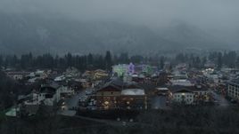 5.7K aerial stock footage of ascending past tall Christmas trees at the center of town, Leavenworth, Washington Aerial Stock Footage | DX0002_227_037