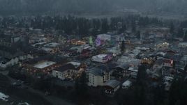 5.7K aerial stock footage of circling town while focused on tall Christmas trees, Leavenworth, Washington Aerial Stock Footage | DX0002_227_039