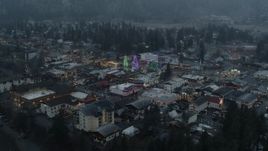 5.7K aerial stock footage orbit town while focused on tall Christmas trees, Leavenworth, Washington Aerial Stock Footage | DX0002_227_040