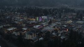 5.7K aerial stock footage approaching a small town decorated with Christmas trees and lights, Leavenworth, Washington Aerial Stock Footage | DX0002_227_048