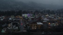 5.7K aerial stock footage orbiting a small town decorated with Christmas trees and lights, Leavenworth, Washington Aerial Stock Footage | DX0002_227_051