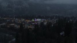 5.7K aerial stock footage of a small town with Christmas trees and lights seen during descent, twilight, Leavenworth, Washington Aerial Stock Footage | DX0002_227_055