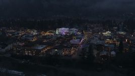 5.7K aerial stock footage of orbiting a small town with Christmas trees and lights at twilight, Leavenworth, Washington Aerial Stock Footage | DX0002_228_001