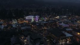 5.7K aerial stock footage of an orbit of a small town with Christmas trees and lights at twilight, Leavenworth, Washington Aerial Stock Footage | DX0002_228_003