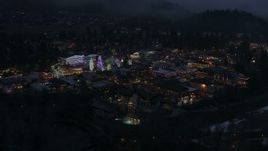 5.7K aerial stock footage of an orbit of Christmas trees and lights at night in Leavenworth, Washington Aerial Stock Footage | DX0002_228_009