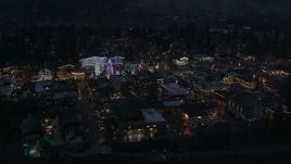 5.7K aerial stock footage of flying around Christmas trees and lights at night in Leavenworth, Washington Aerial Stock Footage | DX0002_228_010