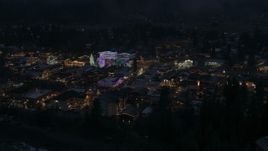 5.7K aerial stock footage orbit and fly away from Christmas trees and lights at night in Leavenworth, Washington Aerial Stock Footage | DX0002_228_011