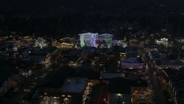 5.7K aerial stock footage of Christmas trees and lights at night in Leavenworth, Washington Aerial Stock Footage | DX0002_228_018
