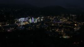 5.7K aerial stock footage ascend with a view of Christmas trees and lights at night, Leavenworth, Washington Aerial Stock Footage | DX0002_228_024