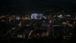 5.7K aerial stock footage circling trees and buildings with Christmas lights at night, Leavenworth, Washington Aerial Stock Footage | DX0002_228_026