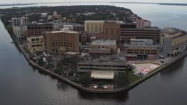 5.7K aerial stock footage of a reverse view of a waterfront hospital in Tampa, Florida Aerial Stock Footage | DX0003_229_018