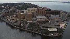 5.7K aerial stock footage of circling a waterfront hospital in Tampa, Florida Aerial Stock Footage | DX0003_229_019
