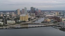 5.7K aerial stock footage of flying by bridges and channel while focused on skyline, Downtown Tampa, Florida Aerial Stock Footage | DX0003_229_043
