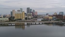 5.7K aerial stock footage of the skyline seen while ascending over bridges, Downtown Tampa, Florida Aerial Stock Footage | DX0003_229_046