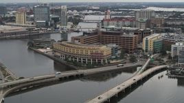 5.7K aerial stock footage reverse view of bridges and a waterfront hospital in Tampa, Florida Aerial Stock Footage | DX0003_230_004