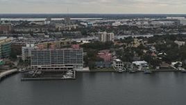 5.7K aerial stock footage of passing by waterfront mansions and condo complex in Tampa, Florida Aerial Stock Footage | DX0003_230_021