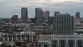 5.7K aerial stock footage of flying by apartment complex, reveal skyline, Downtown Tampa, Florida Aerial Stock Footage | DX0003_230_027