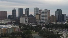5.7K aerial stock footage ascend for a view of tall skyscrapers in the city's skyline, Downtown Tampa, Florida Aerial Stock Footage | DX0003_230_044