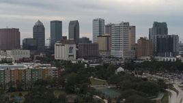 5.7K aerial stock footage descend past tall skyscrapers in the city's skyline, Downtown Tampa, Florida Aerial Stock Footage | DX0003_230_047