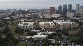 5.7K aerial stock footage circling apartment buildings with city's skyline in background, Downtown Tampa, Florida Aerial Stock Footage | DX0003_231_010