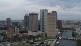 5.7K aerial stock footage of a reverse view of skyscrapers by the river, Downtown Tampa, Florida Aerial Stock Footage | DX0003_231_020