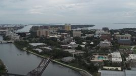 5.7K aerial stock footage reverse view of the University of Tampa campus from the river, Florida Aerial Stock Footage | DX0003_231_024