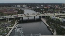 5.7K aerial stock footage heavy traffic on a bridge spanning the river in Tampa, Florida Aerial Stock Footage | DX0003_231_027