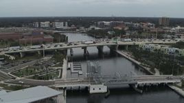 5.7K aerial stock footage orbit traffic on a bridge spanning the river in Tampa, Florida Aerial Stock Footage | DX0003_231_028