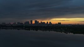 5.7K aerial stock footage wide view of the distant city skyline of Downtown Tampa, Florida at sunset Aerial Stock Footage | DX0003_231_041