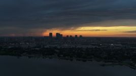 5.7K aerial stock footage of the distant city skyline of Downtown Tampa, Florida at sunset Aerial Stock Footage | DX0003_231_042