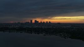 5.7K aerial stock footage of the distant city skyline of Downtown Tampa, Florida at sunset Aerial Stock Footage | DX0003_231_044