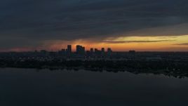 5.7K aerial stock footage a view of the Downtown Tampa skyline from the bay at sunset, Florida Aerial Stock Footage | DX0003_231_050