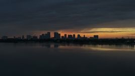 5.7K aerial stock footage fly toward Downtown Tampa skyline from the bay at sunset, Florida Aerial Stock Footage | DX0003_231_053