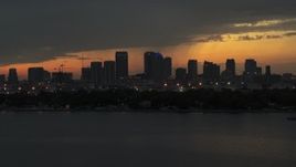5.7K aerial stock footage passing by skyscrapers in the Downtown Tampa skyline at twilight, Florida Aerial Stock Footage | DX0003_232_015