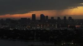 5.7K aerial stock footage descend past skyscrapers in the Downtown Tampa skyline at twilight, Florida Aerial Stock Footage | DX0003_232_018