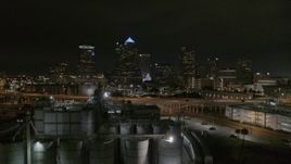 5.7K aerial stock footage fly over flour mill to approach skyscrapers at night in Downtown Tampa, Florida Aerial Stock Footage | DX0003_232_029