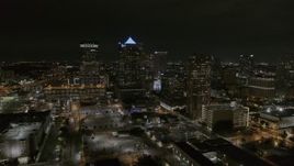 5.7K aerial stock footage of a reverse view of skyscrapers at night in Downtown Tampa, Florida Aerial Stock Footage | DX0003_232_030