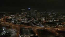 5.7K aerial stock footage descend while focused on skyscrapers at night in Downtown Tampa, Florida Aerial Stock Footage | DX0003_232_031