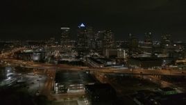 5.7K aerial stock footage a stationary view of skyscrapers at night in Downtown Tampa, Florida Aerial Stock Footage | DX0003_232_032