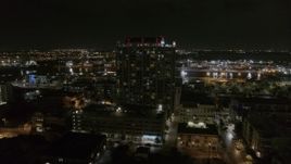 5.7K aerial stock footage of orbiting apartment building at nighttime in Downtown Tampa, Florida Aerial Stock Footage | DX0003_232_038