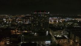 5.7K aerial stock footage of circling an apartment building at night in Downtown Tampa, Florida Aerial Stock Footage | DX0003_232_039