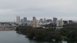5.7K aerial stock footage descend away from hotel and the city's skyline, Downtown Orlando, Florida Aerial Stock Footage | DX0003_233_006