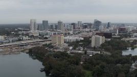 5.7K aerial stock footage of the city's skyline seen from Lake Concord, Downtown Orlando, Florida Aerial Stock Footage | DX0003_233_008