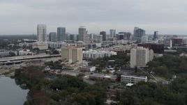 5.7K aerial stock footage of flying toward hotel and the city's skyline, Downtown Orlando, Florida Aerial Stock Footage | DX0003_233_009